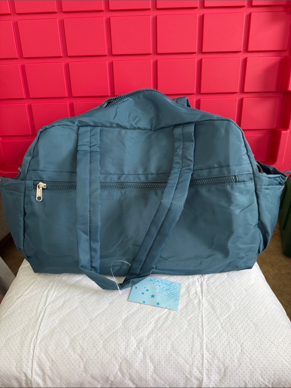 Teal Travel Duffel Bag with Front Zip Pocket. With Luggage strap on back